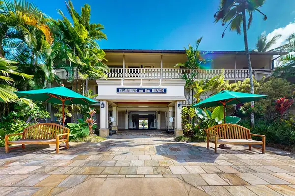 Welcoming resort entrance with lush landscaping