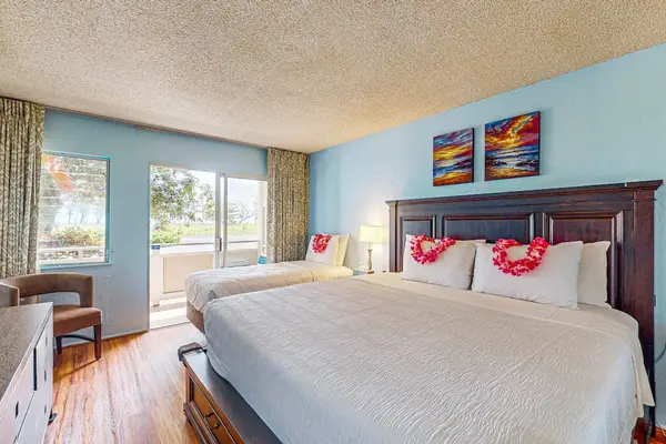 Master bedroom with king bed, single bed and a fold up crib for your use.