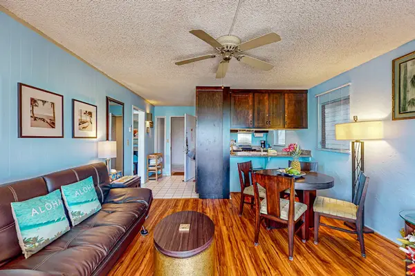 Lovely home decor, spacious living room with a flat screen tv and sleeper sofa.