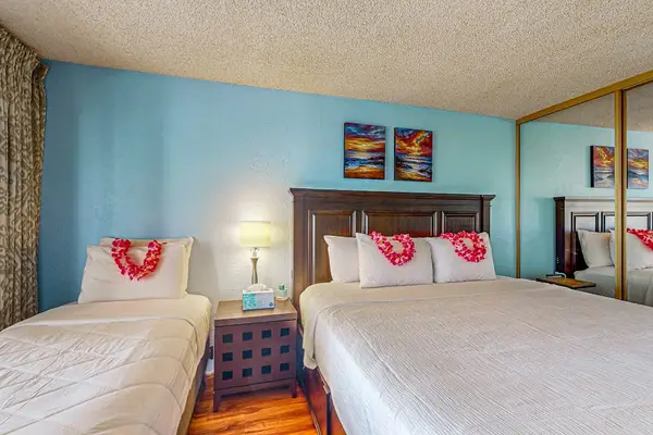 Master bedroom with king bed, single bed and a fold up crib for your use.