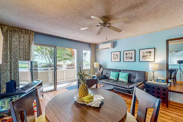 Lovely home decor, spacious living room with a flat screen tv and sleeper sofa.