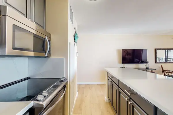 Newly updated kitchen with new stainless steel appliances.