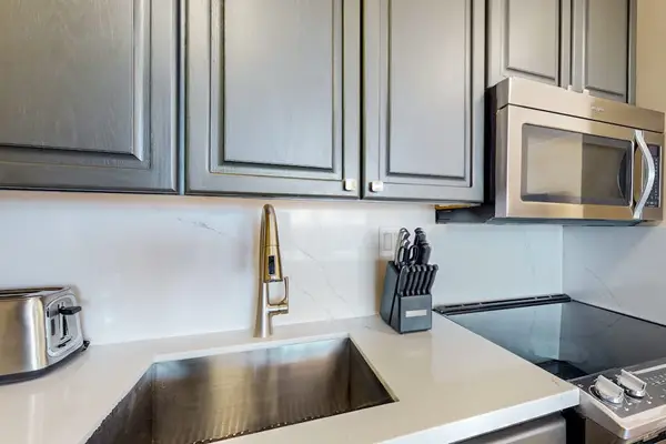 Newly updated kitchen with new stainless steel appliances.
