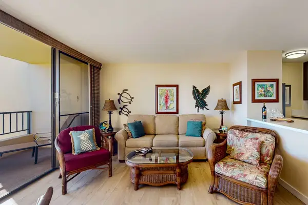 Bright living room with direct access to the private lanai, where beach views and swaying palm trees await.  With a comfortable sofa bed for extra company.