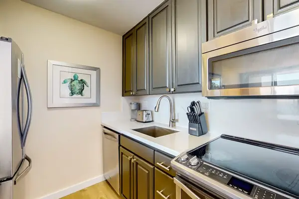 Newly updated kitchen with new stainless steel appliances.