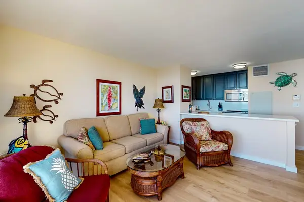 Bright living room with direct access to the private lanai, where beach views and swaying palm trees await.  With a comfortable sofa bed for extra company.