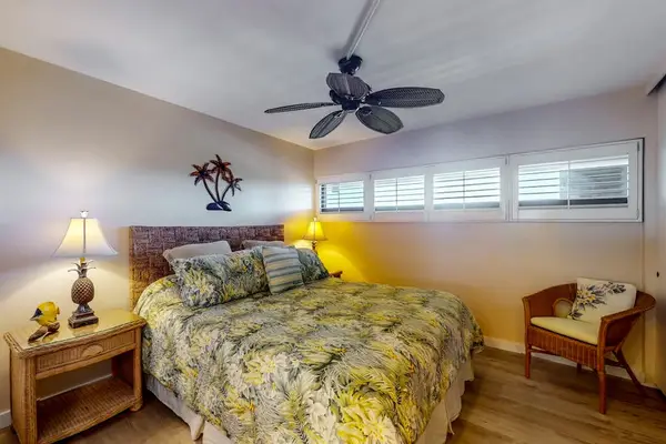 Bedroom with king bed, ceiling fan, en suite bathroom and a flat screen TV