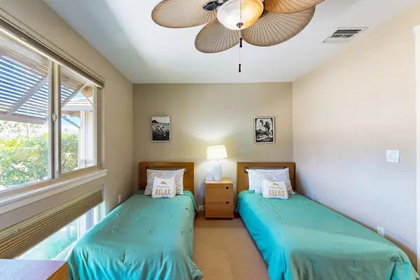 Guest bedroom with two twin beds.