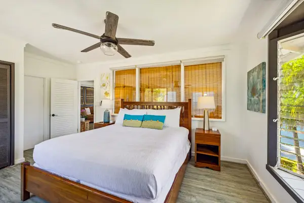 Master bedroom with a king bed, huge picture windows and access to your private lanai.
