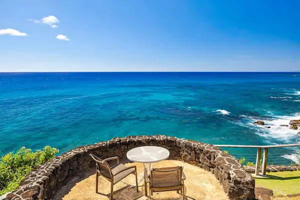 From your oceanfront perch on a lava-rock cliff, a dazzling ombre of blues tantalizes the eyes and the smell of saltwater tickles your nose. Let the ocean breezes warm you as you lounge on multiple lanais, listening to the waves crash below.