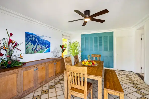 Dining room with table and seating for six.