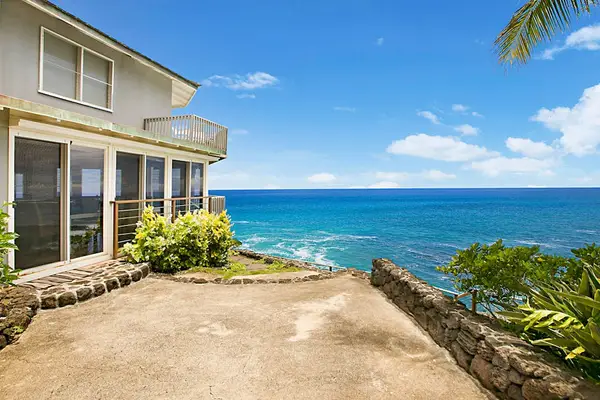 Relax on the outdoor patio as you enjoy the Pacific Ocean views in your private tropical paradise.