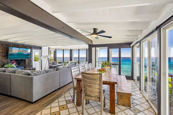 Dining room with panoramic views of the tropical paradise, with seating for ten.