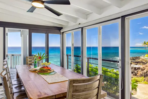 Dining room with panoramic views of the tropical paradise, with seating for ten.