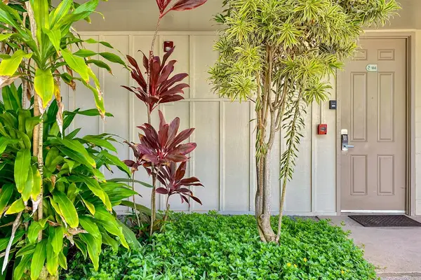 Welcoming entrance surrounded by greenery
