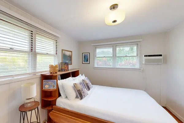 Master bedroom features a comfortable queen bed for restful nights every stay