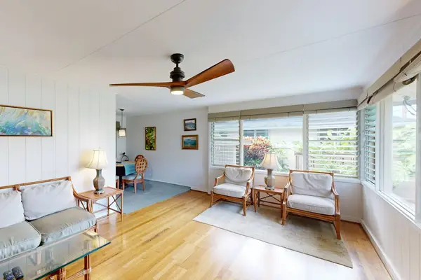 Natural light fills the spacious living room with warmth and inviting charm