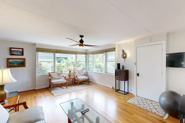 Sunlit living room offers spacious comfort for relaxing throughout your island getaway