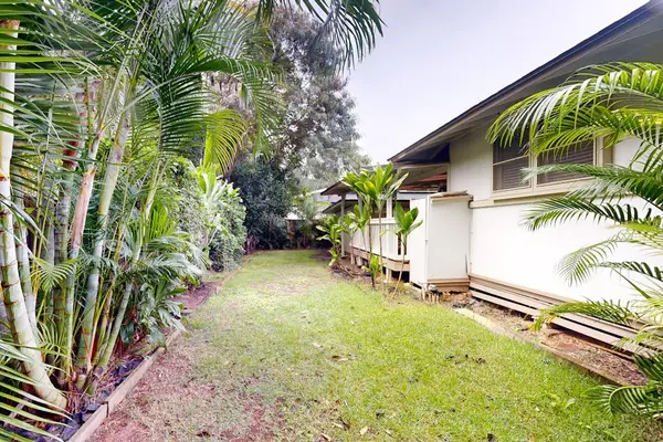 Enjoy peaceful moments in the backyard framed by lush natural greenery everywhere