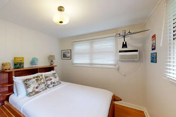 Queen size bed makes the third bedroom warm welcoming and wonderfully comfortable