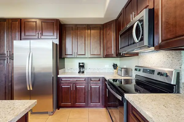 Fully Stocked Kitchen Featuring Sleek Stainless Steel Appliances