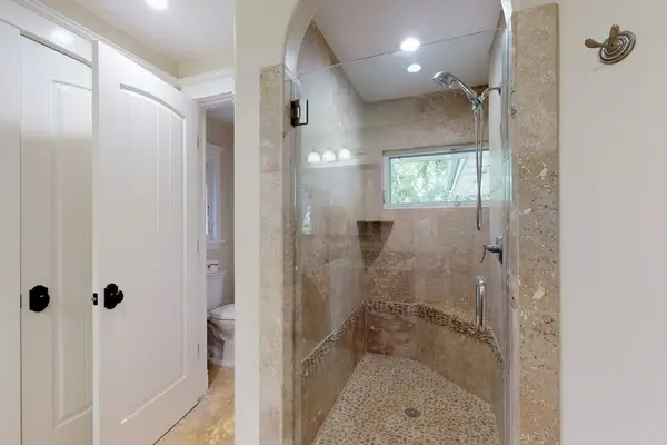 Guest bathroom with walk-in shower.