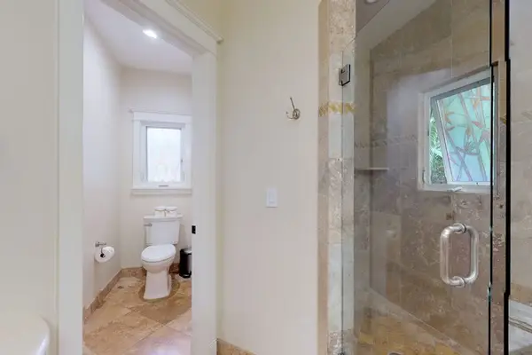 Guest bathroom with garden tub and walk-in shower.