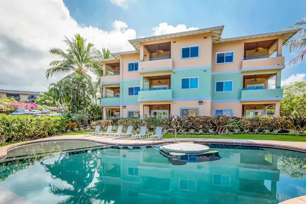 Resort Swimming Pool and Sundeck Overlooking the Multi-Story Property Complex