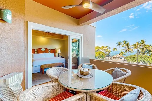 Covered Balcony Dining Space with Seating for Four and Direct Bedroom Access