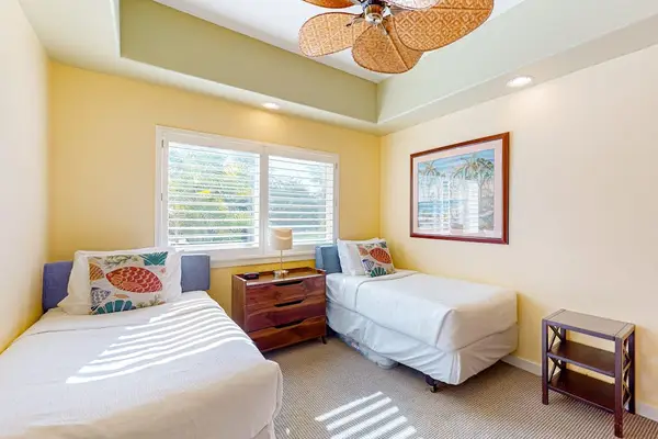 Guest Bedroom with Two Twin Beds, Shared Center Nightstand, and Ceiling Fan