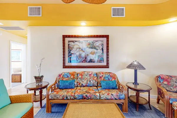 Comfortable Living Room Sofa with Framed Artwork and Accent Lighting
