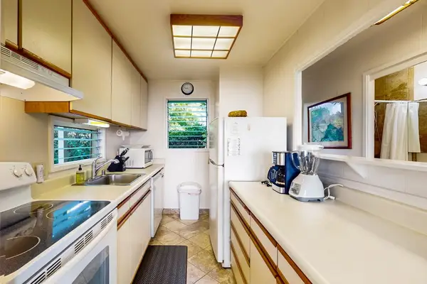 Bright kitchen equipped with everything needed for home-style cooking.