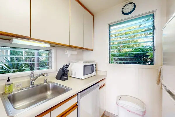 Functional kitchen featuring modern appliances and natural light.
