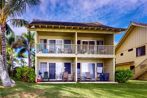 Charming oceanfront building nestled among tropical surroundings.