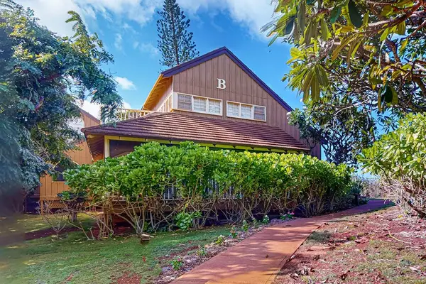 Tropical resort exterior features landscaped grounds and welcoming pathways