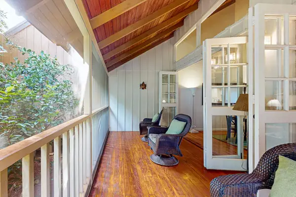 Cozy balcony seating offers a welcoming place to relax and enjoy the outdoors