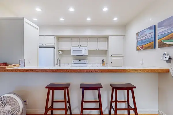 Open kitchen includes an extra dining area for added comfort during your stay