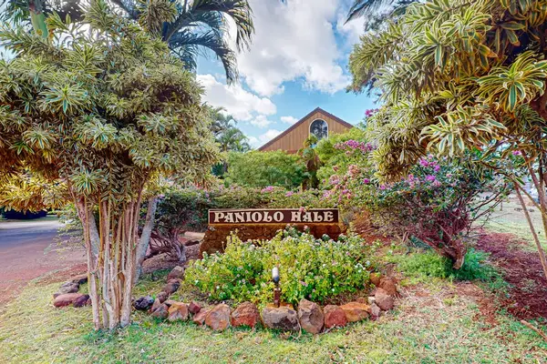 Paniolo Hale property sign welcomes guests amid tropical landscaped grounds