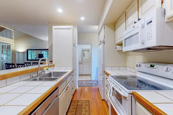 Contemporary kitchen with additional dining space makes entertaining and mealtime effortless every day