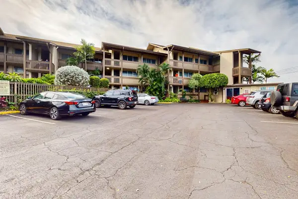 Front entrance parking surrounded by well-kept landscaping