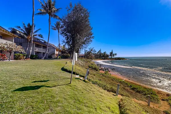 Enjoy sweeping ocean views from the beautifully maintained beachfront lawn.