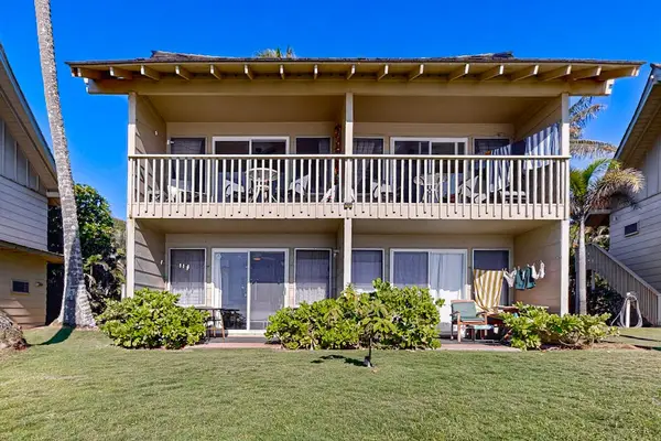 Exterior view of the oceanfront accommodations in a tropical setting.