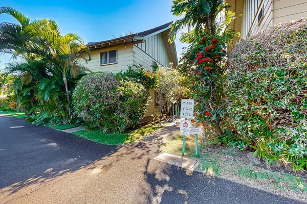Beautifully landscaped property exterior surrounded by tropical greenery.