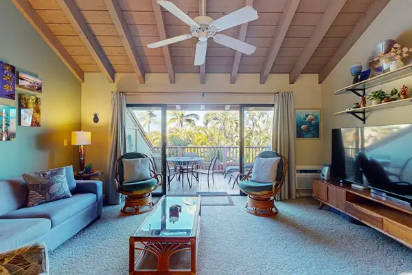 Inviting living room with soaring vaulted ceilings