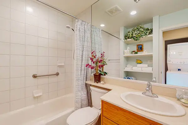 Fresh full bathroom with a spacious walk-in shower