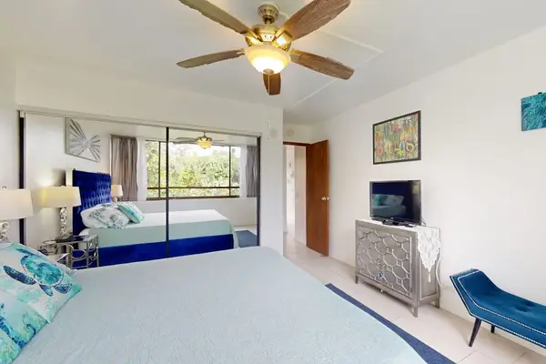 Comfortable Primary Bedroom With Scenic Views