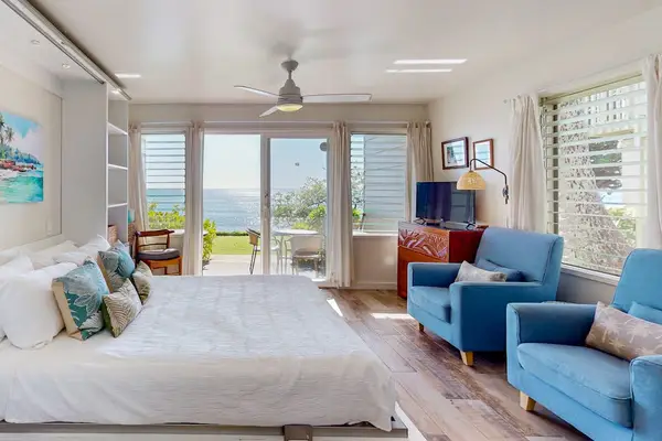 Spacious studio with comfortable seating and stunning oceanfront views.