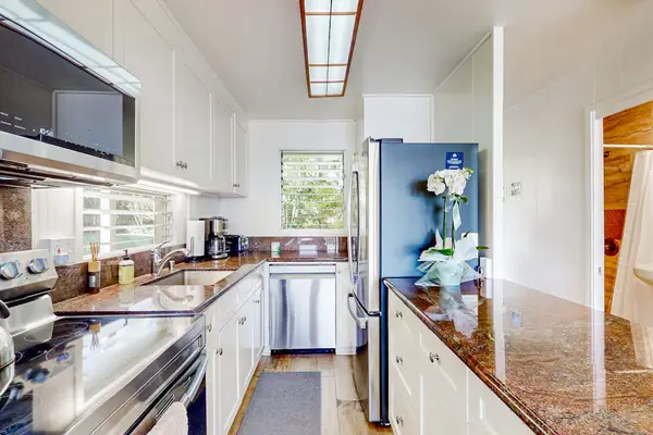 Bright kitchen equipped for preparing meals with ease.