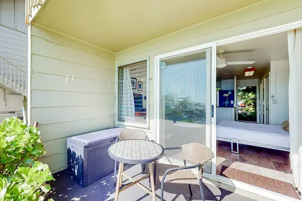 Private lanai with outdoor seating for relaxing in the island breeze.
