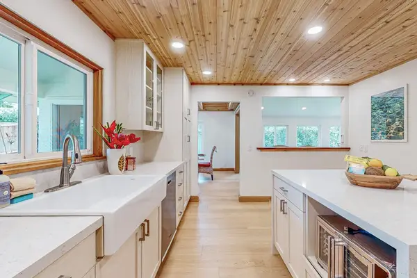 Kitchen island and bright counters create an inviting cooking space